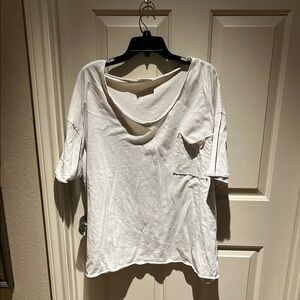 Cream wide neck oversized tee with pockets!
